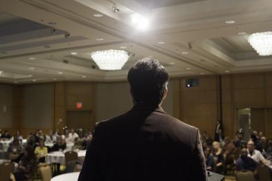 speaker facing crowed photo